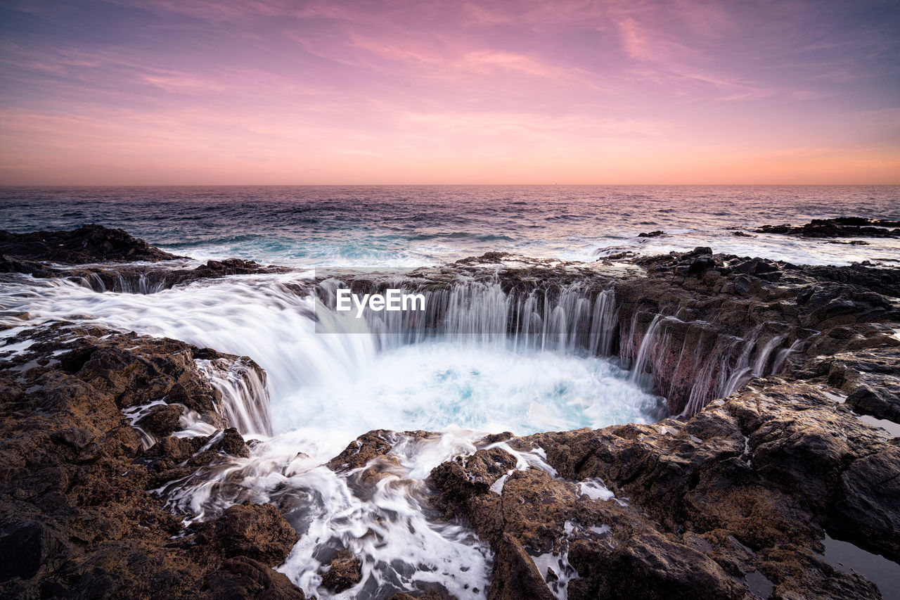 Scenic view of sea against sky during sunset