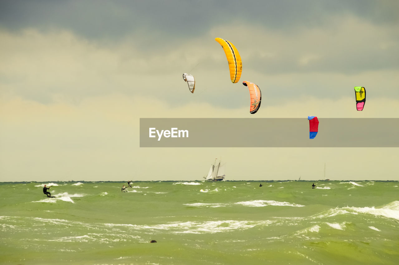 VIEW OF KITE FLYING OVER SEA