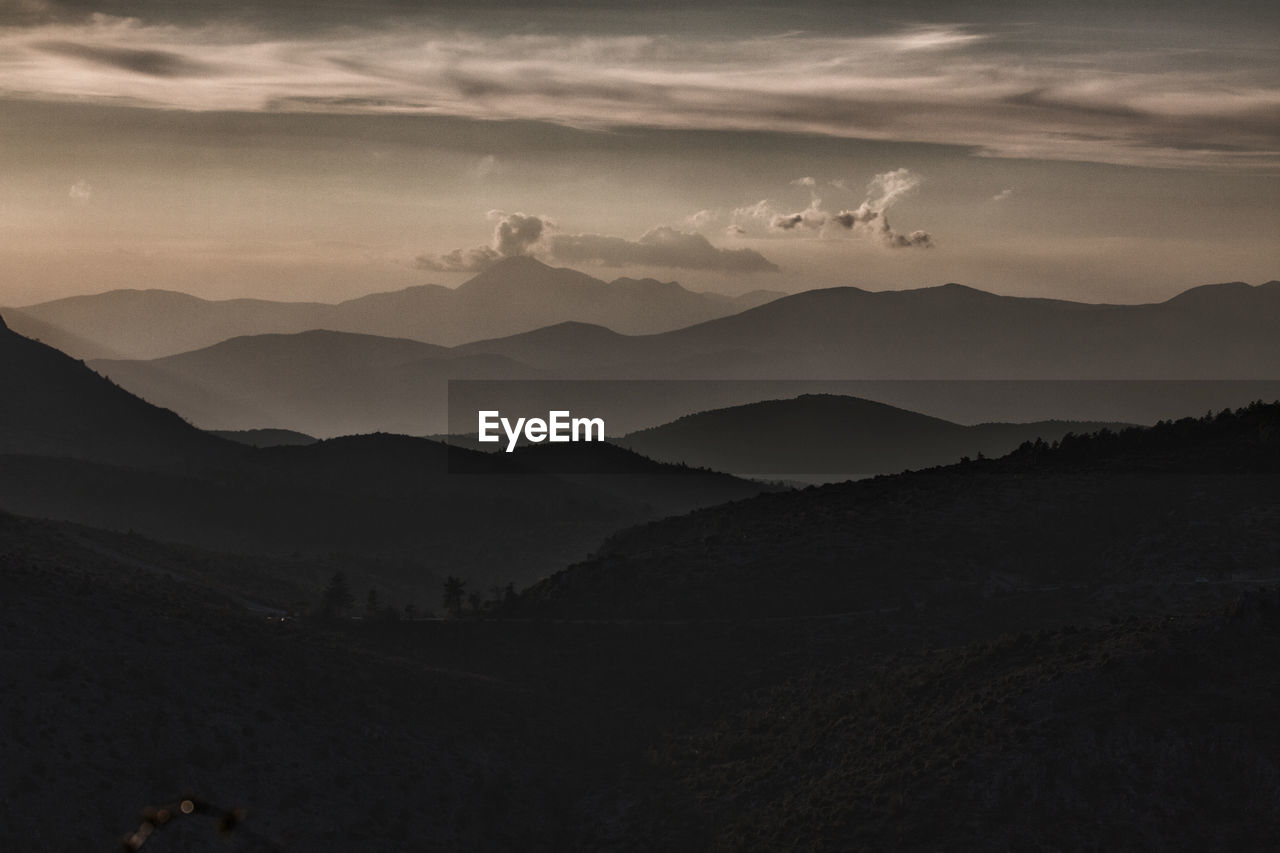 Scenic view of silhouette mountains against sky