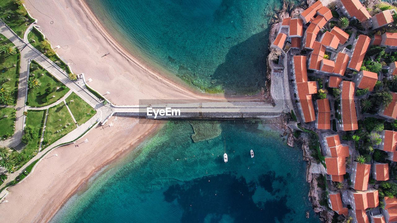 Aerial view of houses by sea