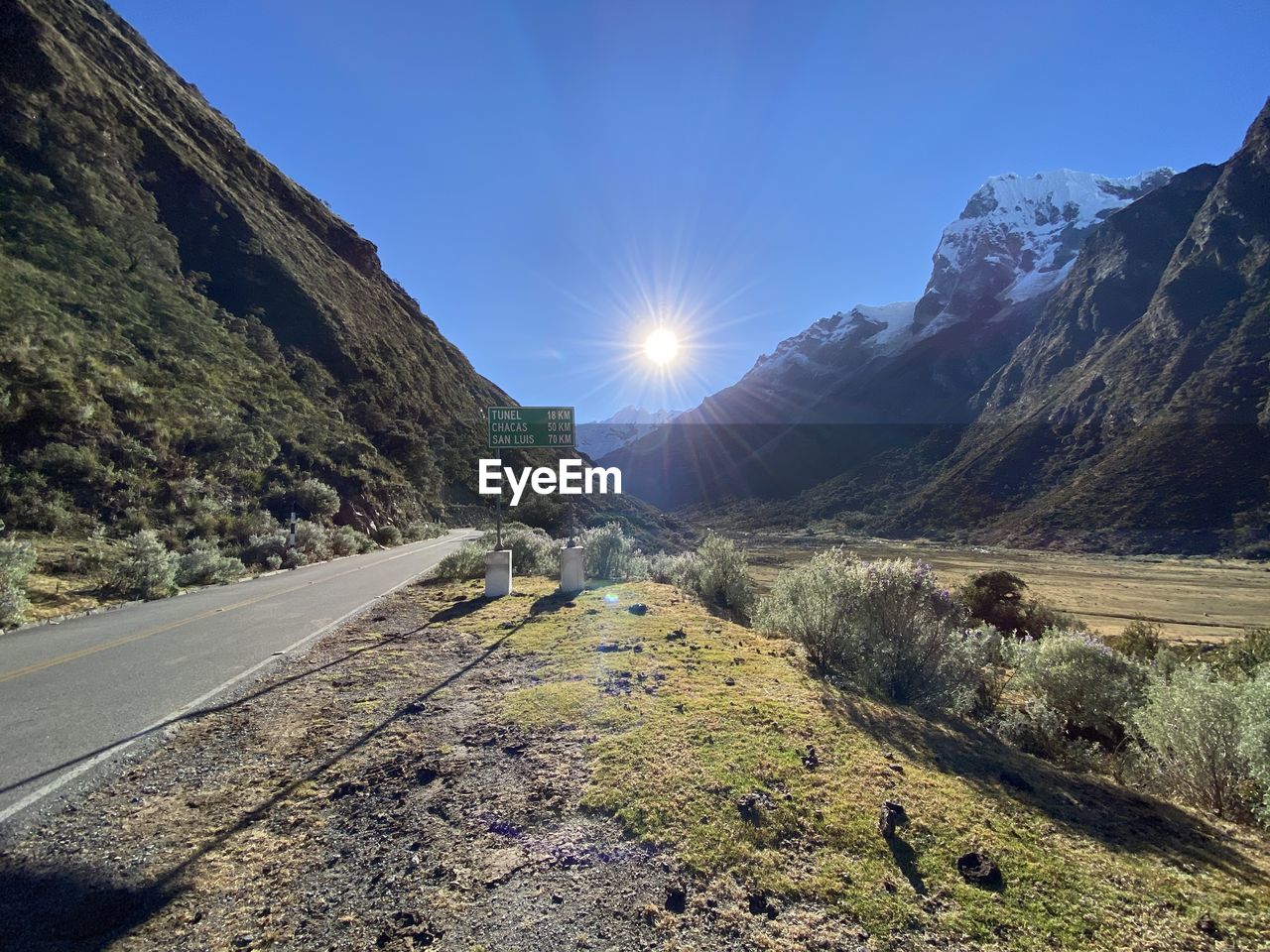 Road amidst mountains against sky