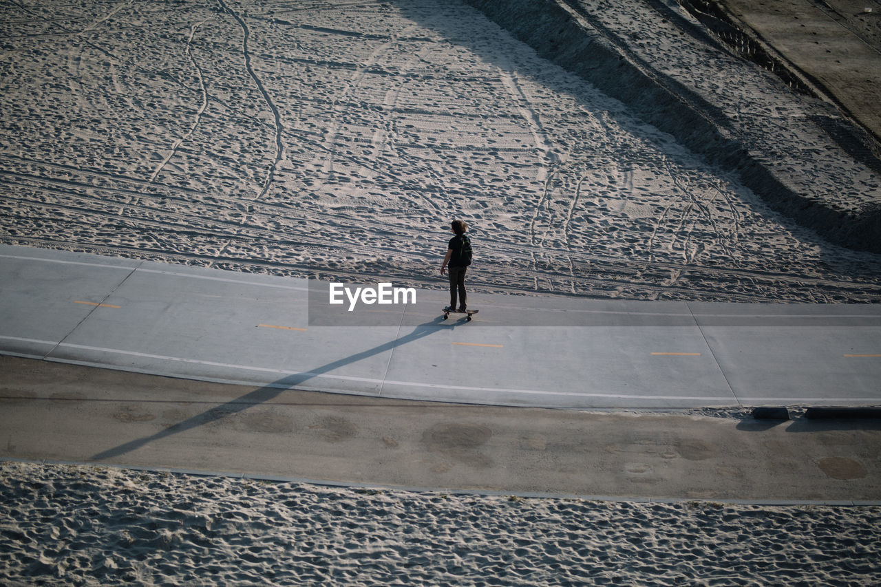 High angle view of man skateboarding on street