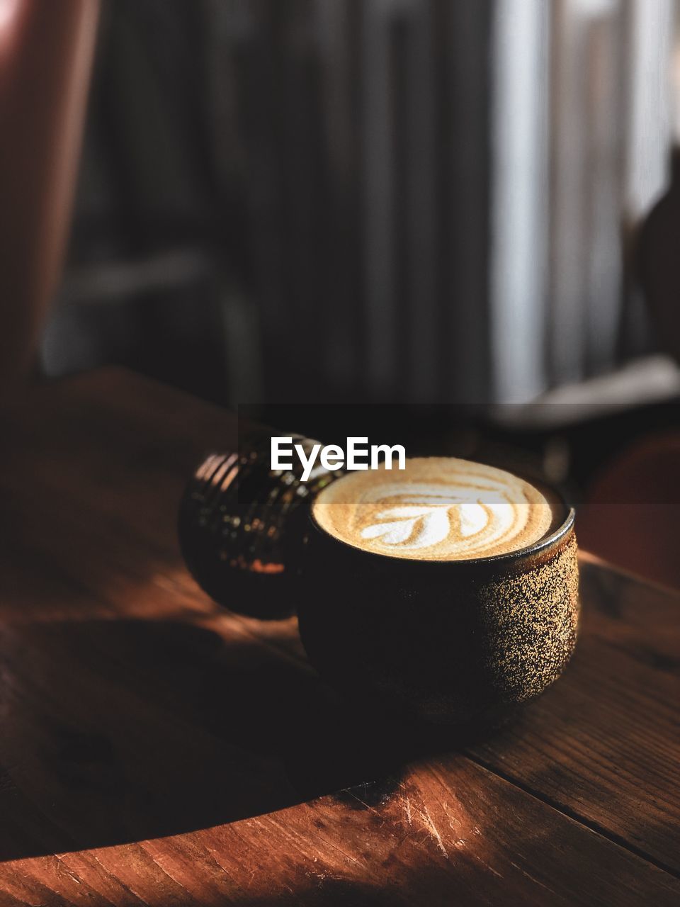 Close-up of coffee cup on table