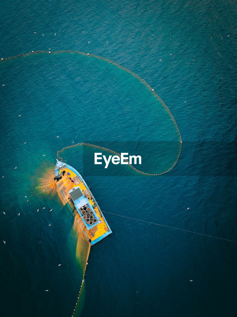 High angle view of ship sailing in sea