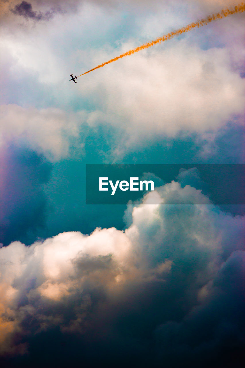 Low angle view of vapor trails in sky