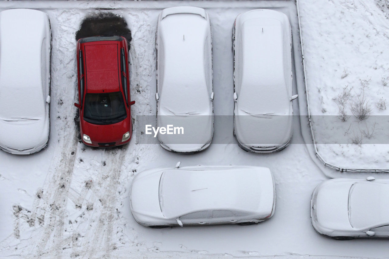 High angle view of frozen cars on road