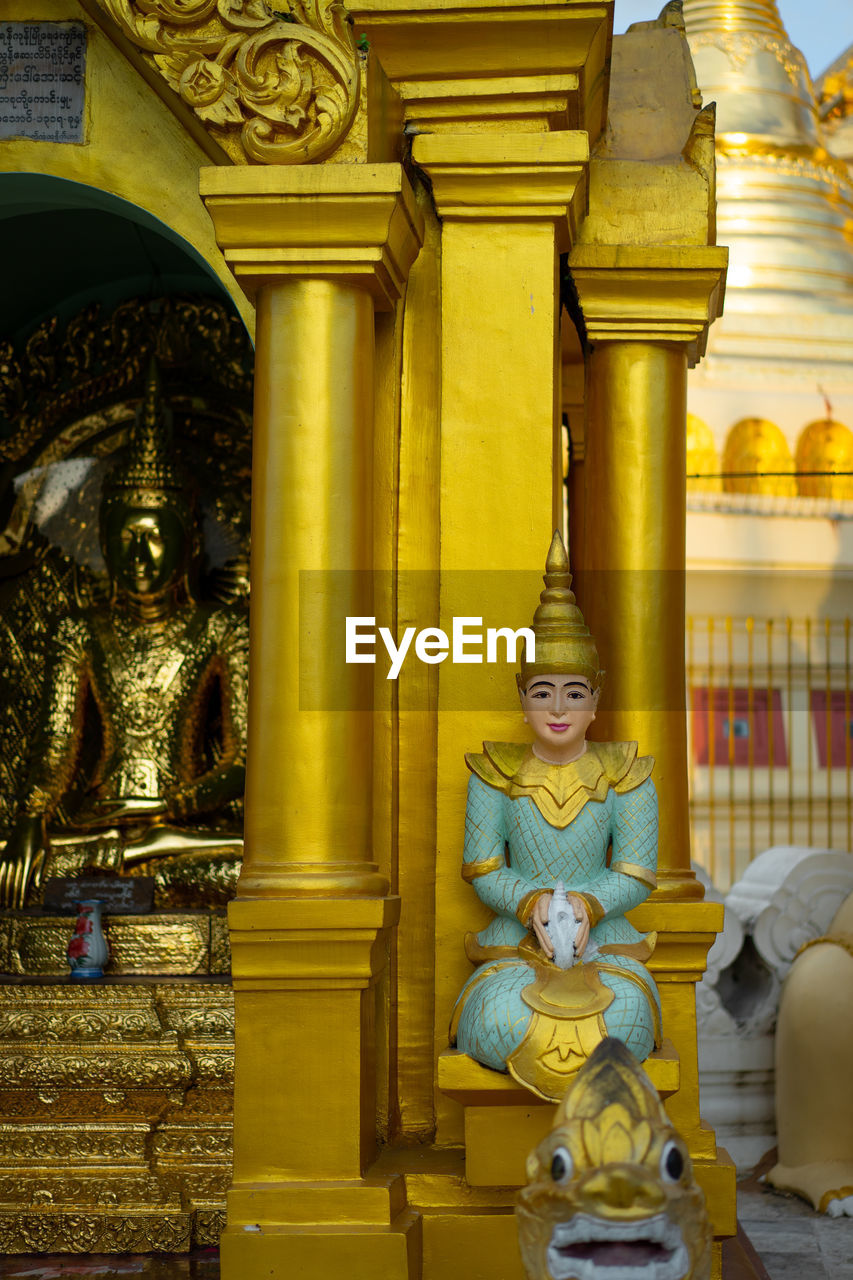 Buddha statue in temple outside building