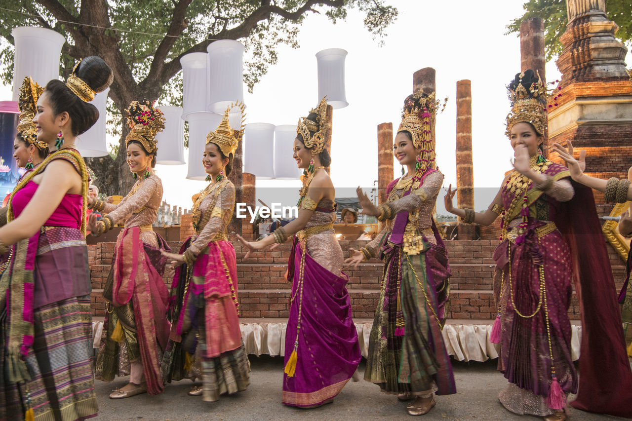 GROUP OF PEOPLE IN TRADITIONAL CLOTHING