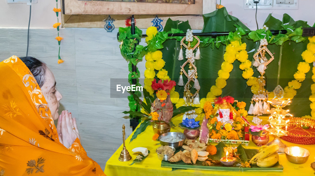 yellow, no people, multi colored, nature, representation, flower, creativity, craft, day, tradition, decoration, religion, outdoors, flowering plant, belief, nautical vessel