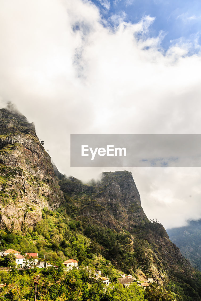 Scenic view of rocky mountains against sky