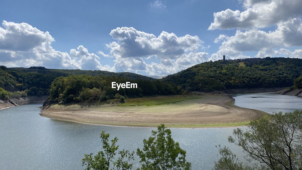 SCENIC VIEW OF RIVER AND TREES AGAINST SKY