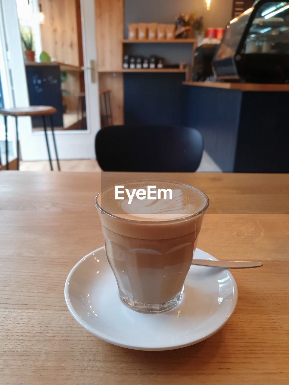 CLOSE-UP OF COFFEE SERVED ON TABLE IN CAFE