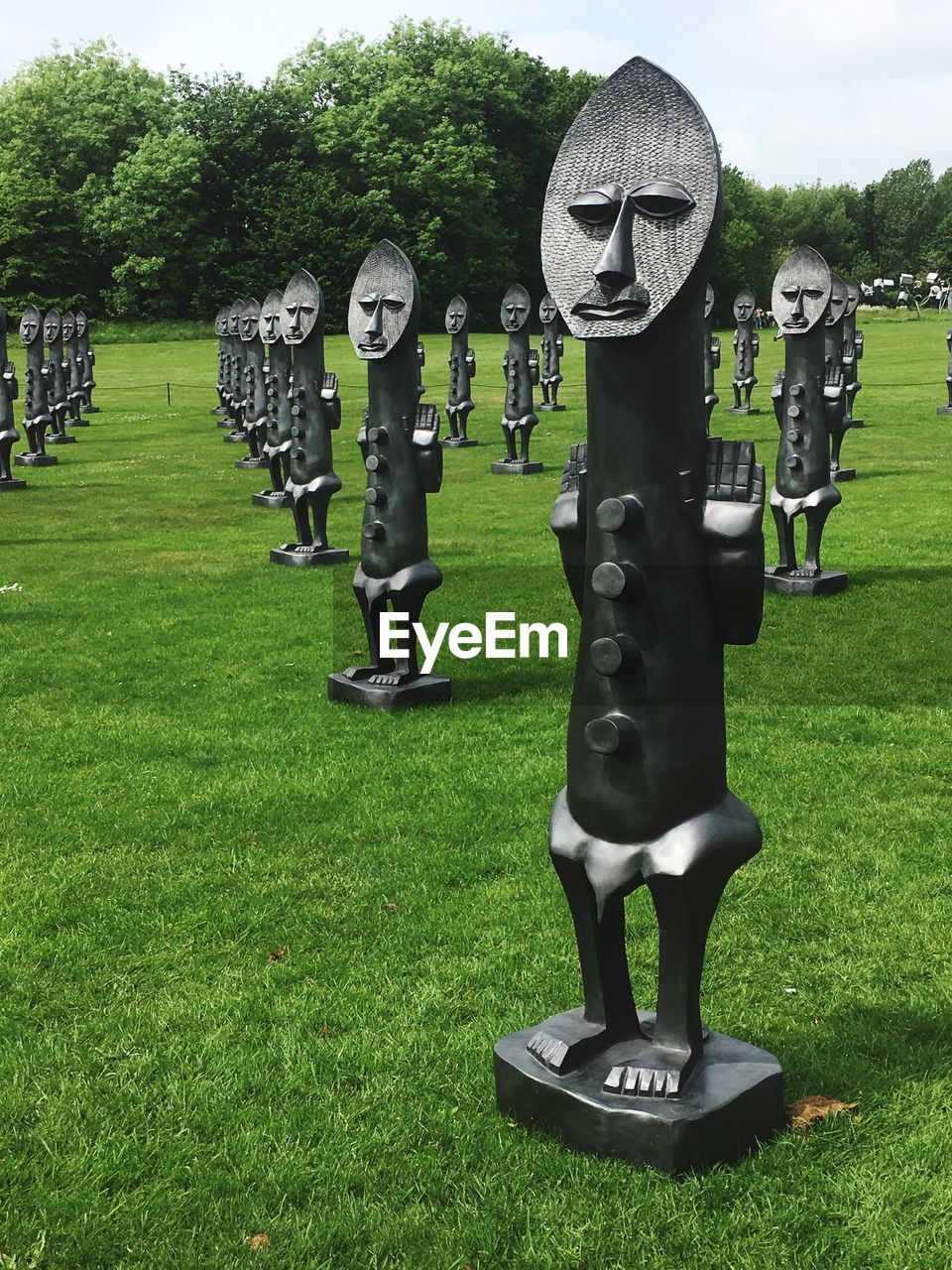 CEMETERY ON FIELD AGAINST TREES