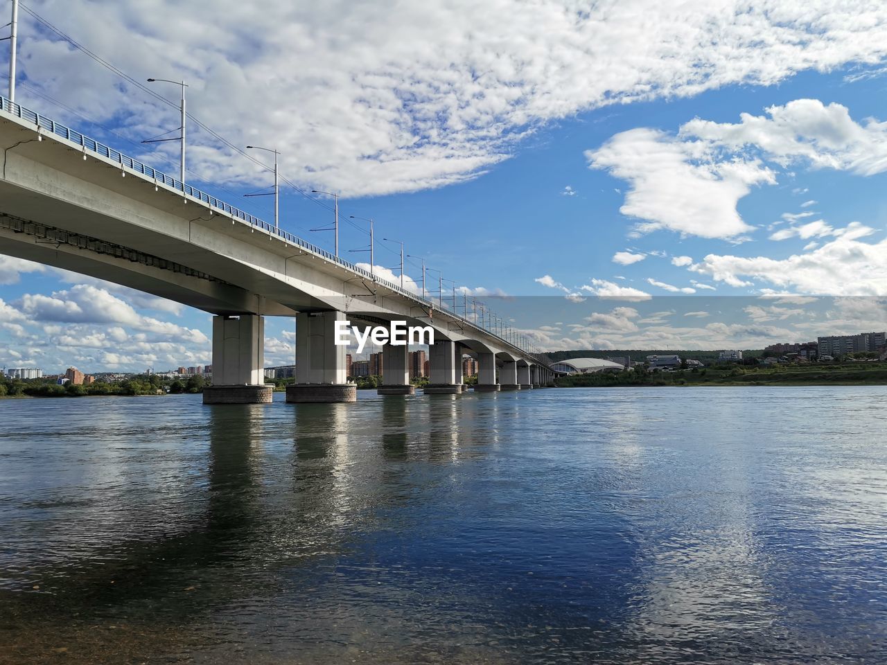 Low angle view of bridge over river against sky