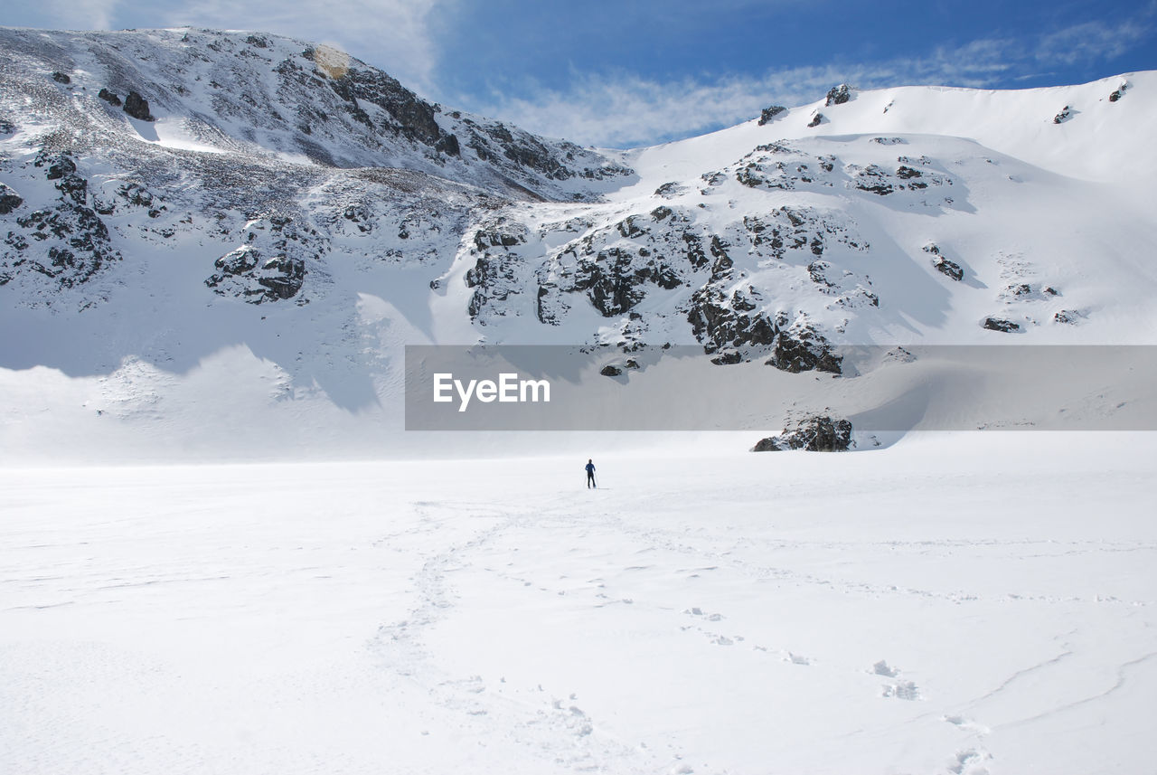 Scenic view of snow covered mountains and frozen lake