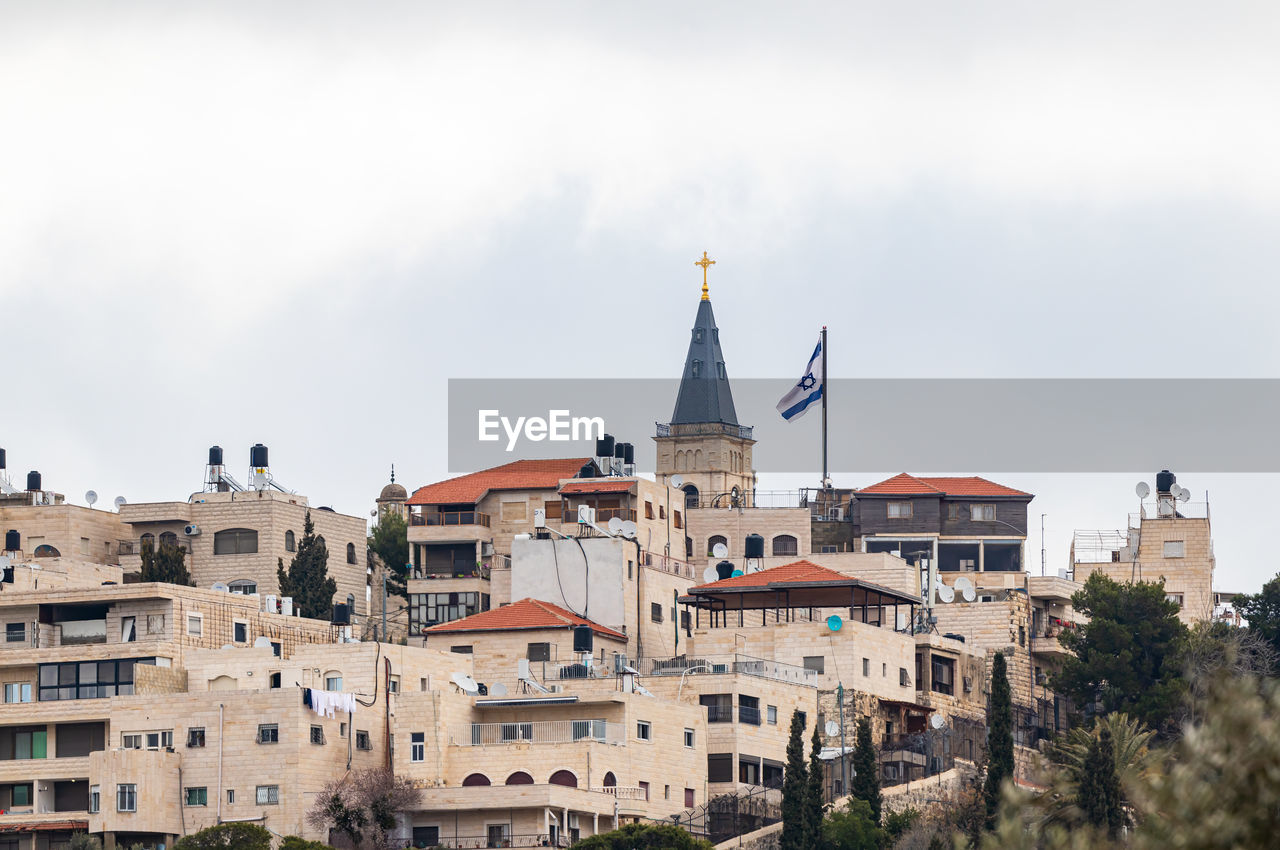 Low angle view of church in city against sky