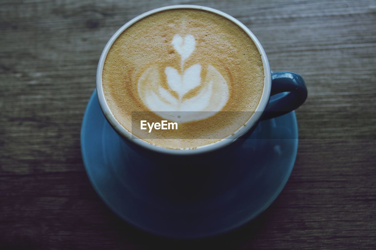 CLOSE-UP OF CAPPUCCINO ON TABLE