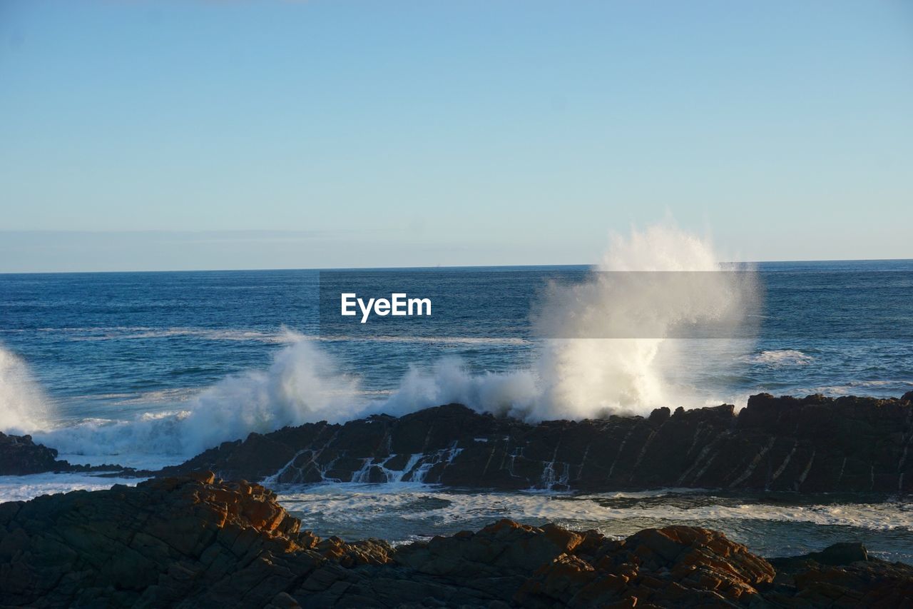 Waves splashing on rocks