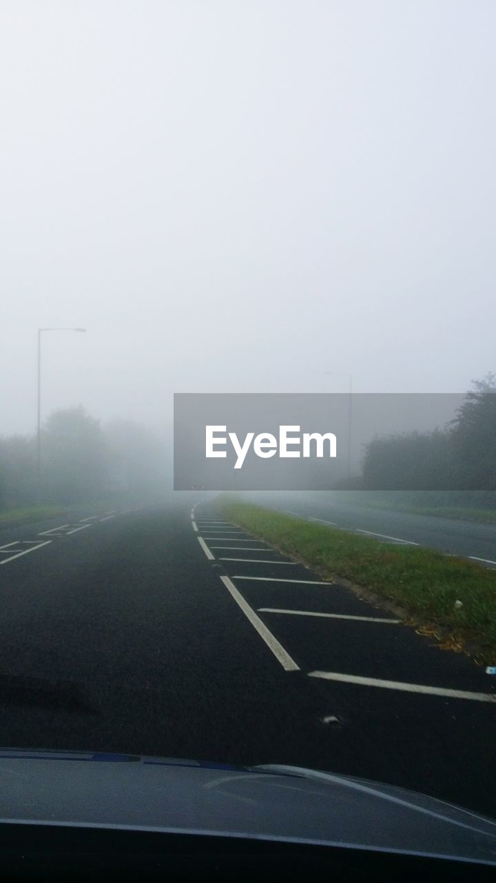 Road against sky during foggy weather