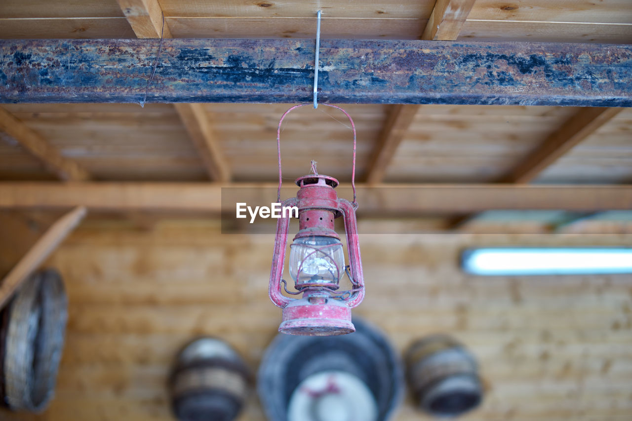 Close-up of lantern hanging from ceiling