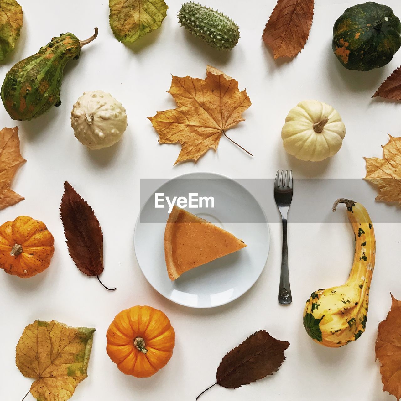 High angle view of fruits and leaves on table