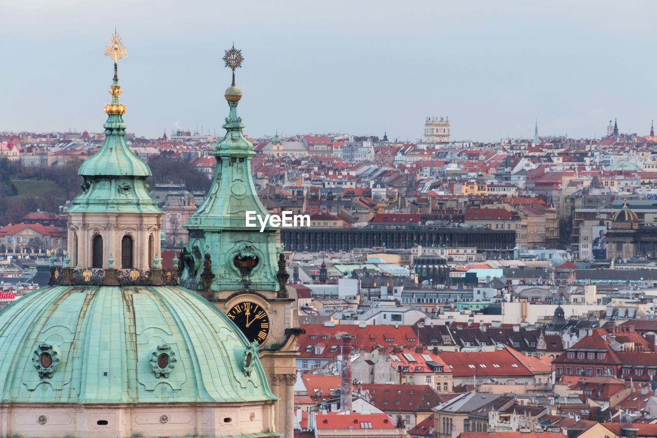 Cathedral by buildings in city