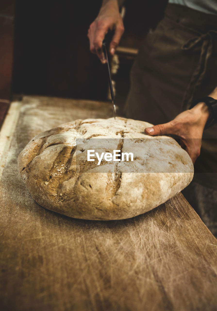 Production of baked bread in a bakery.