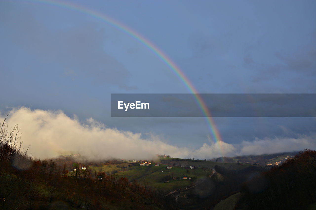 RAINBOW OVER LANDSCAPE