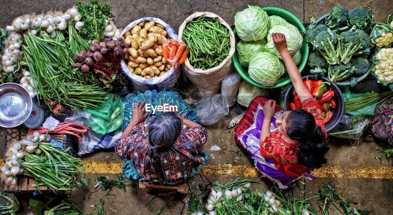 HIGH ANGLE VIEW OF FRUITS AND VEGETABLES IN MARKET STALL