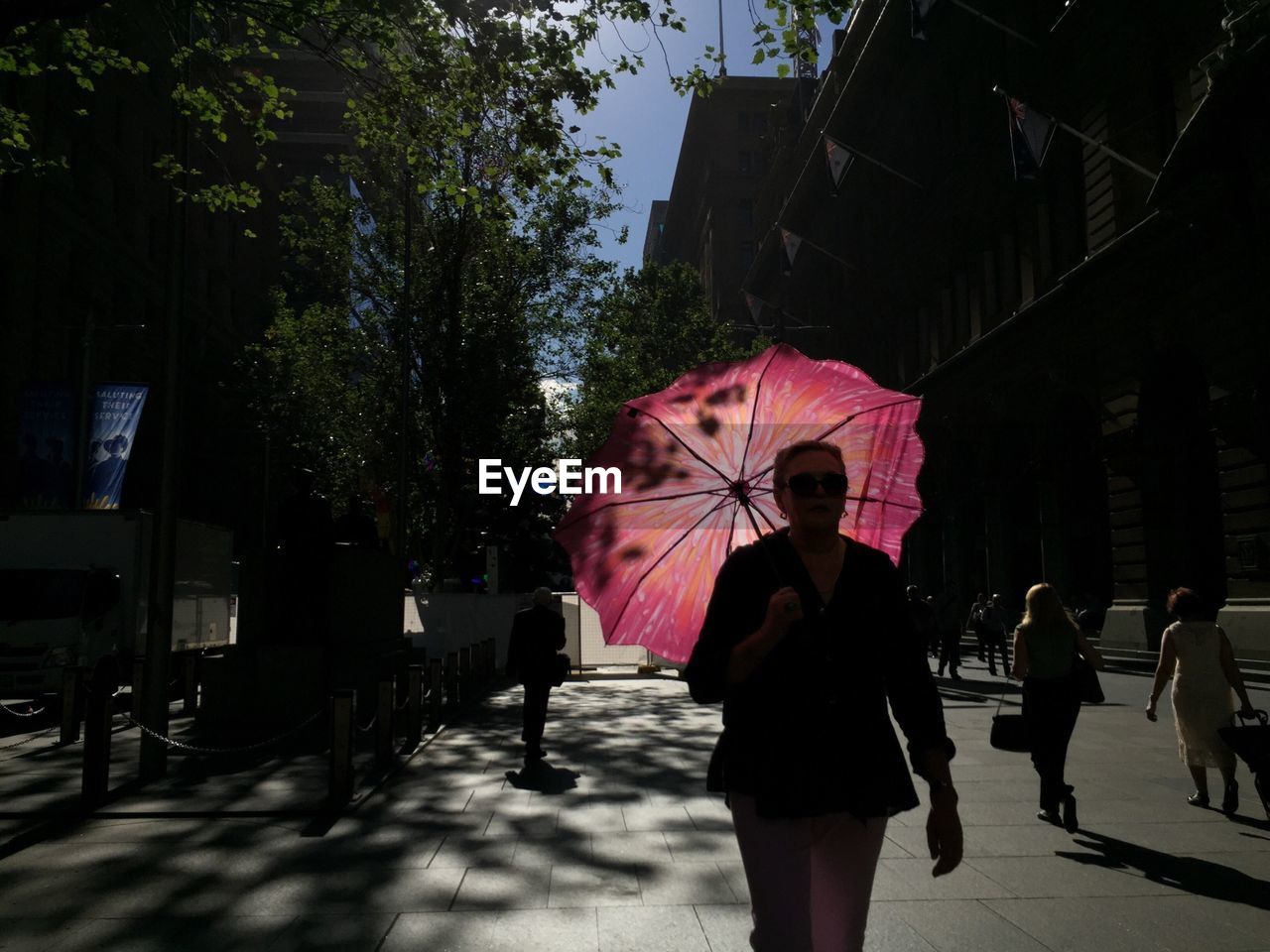 WOMAN WALKING IN CITY