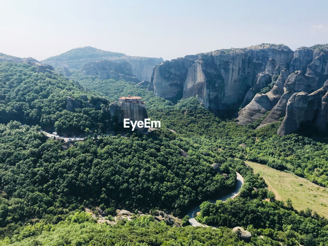 HIGH ANGLE VIEW OF TREES AND MOUNTAIN AGAINST SKY