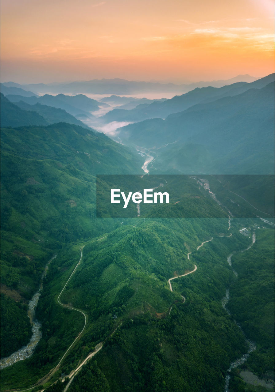 Aerial view of landscape against sky during sunset