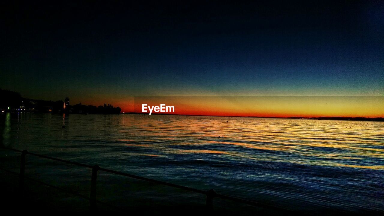VIEW OF SEA AT SUNSET