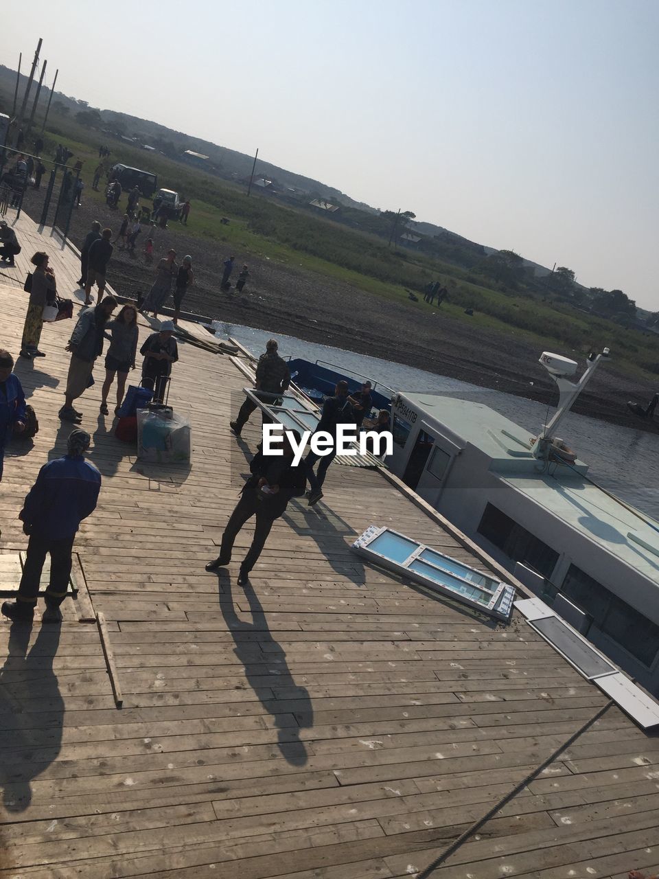 VIEW OF PEOPLE STANDING ON WALL