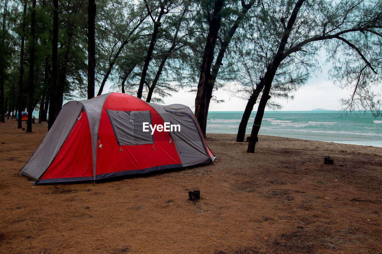 TENT ON BEACH BY SEA