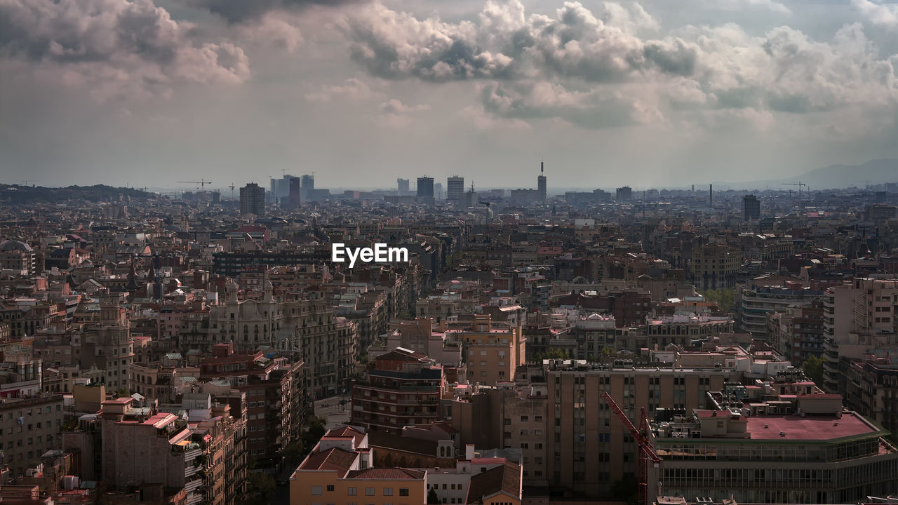 Aerial view of cityscape against sky