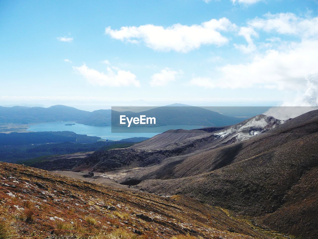 Scenic view of landscape and mountains against sky