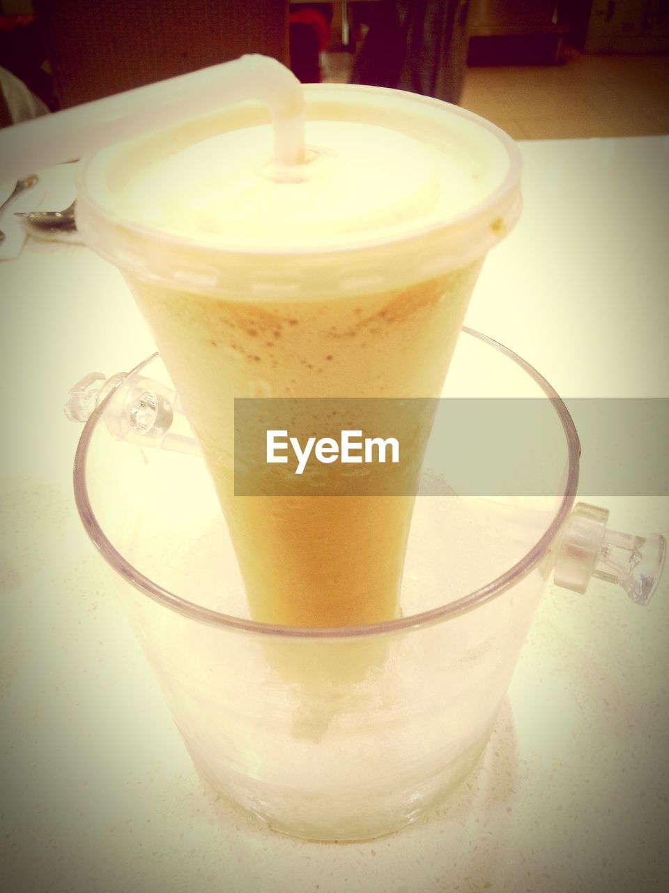 CLOSE-UP OF COFFEE CUP ON TABLE