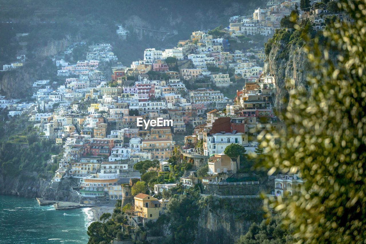 High angle view of townscape by sea