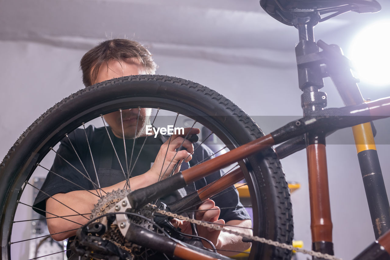 REFLECTION OF MAN ON BICYCLE