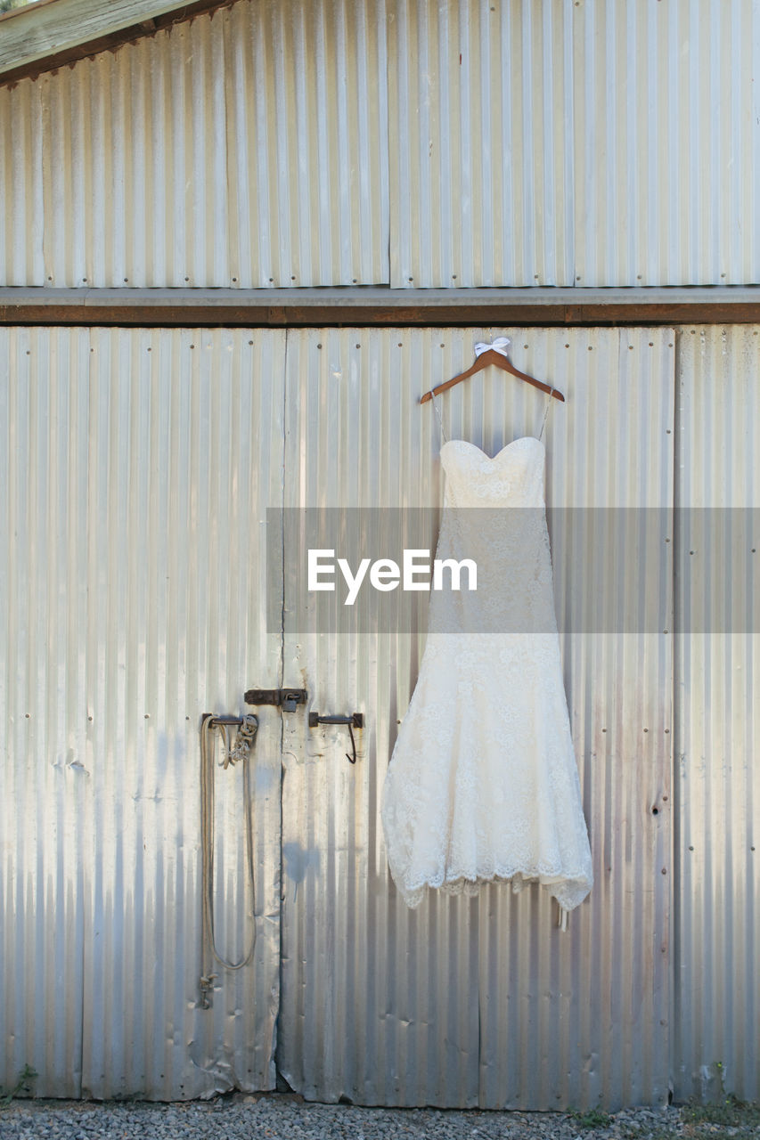 CLOTHES DRYING ON WHITE WALL