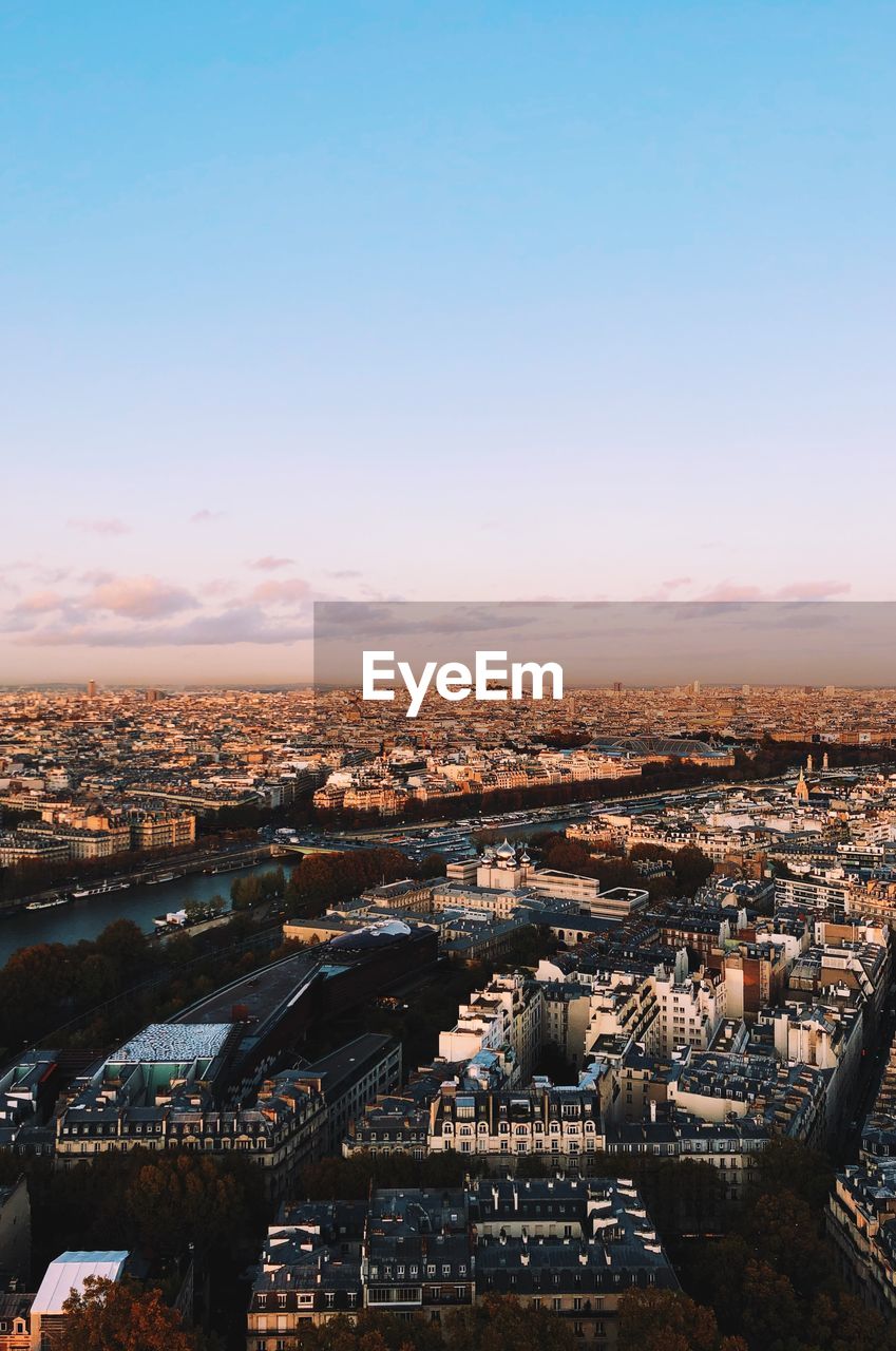 High angle view of city against sky during sunset