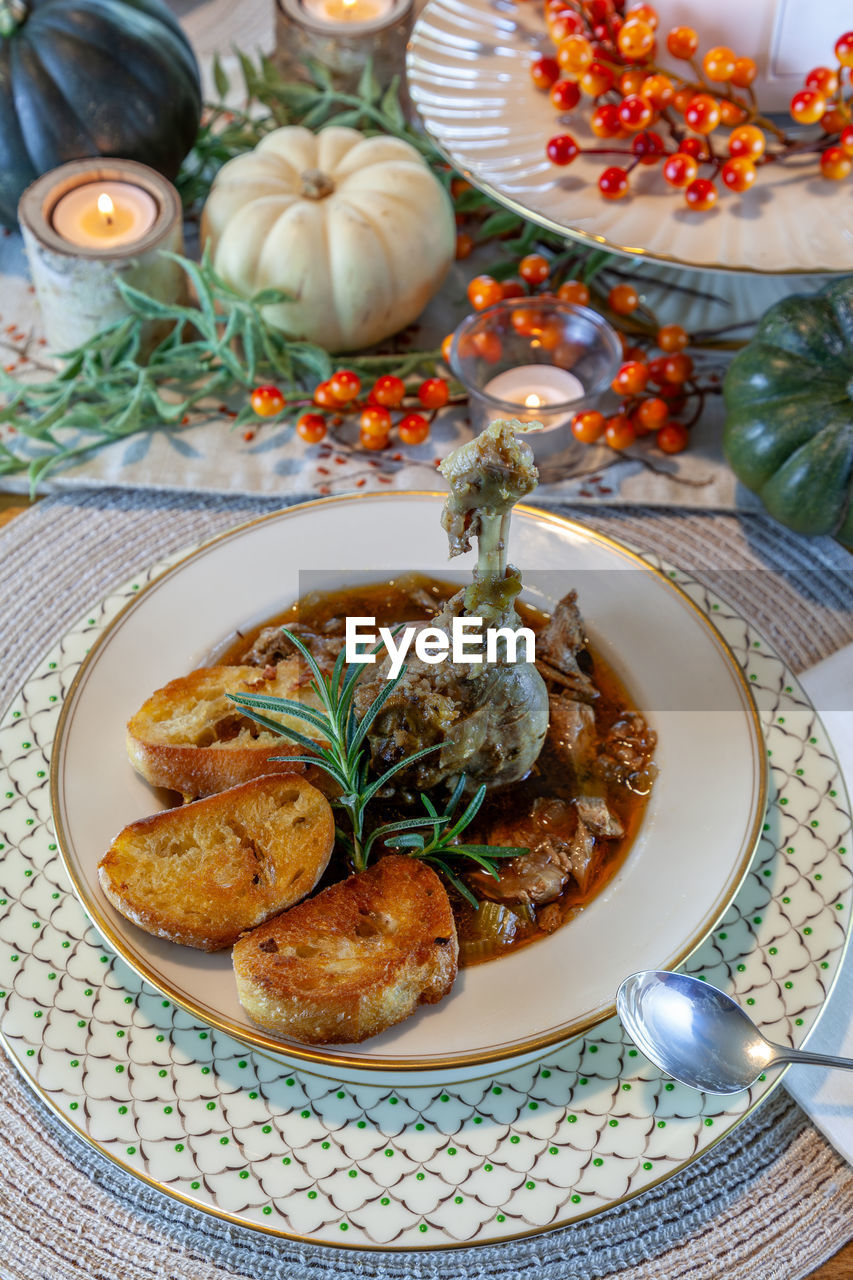 food and drink, food, plate, dish, holiday, vegetable, healthy eating, celebration, meal, plant, herb, no people, christmas, meat, dinner, table, tradition, indoors, wellbeing, roasted, freshness, spice, produce, nature, fruit, decoration, high angle view, breakfast, winter, tablecloth, crockery