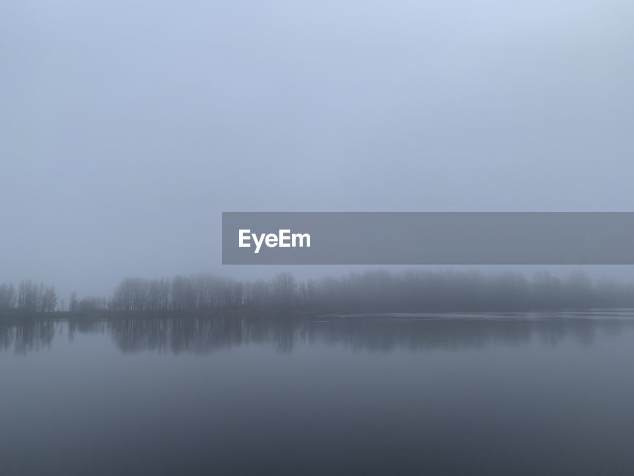 SCENIC VIEW OF LAKE BY TREES AGAINST SKY