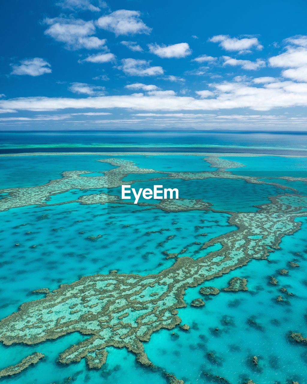 Scenic view of sea against blue sky