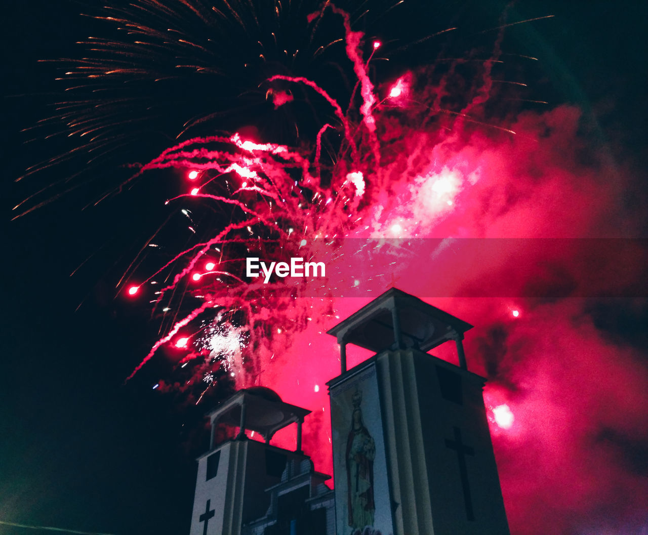 LOW ANGLE VIEW OF FIREWORKS DISPLAY