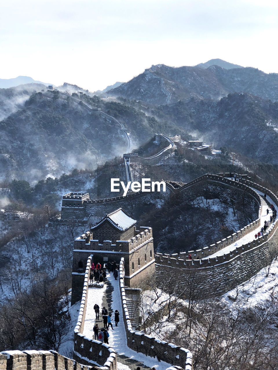 Aerial view of great wall of china during winter against sky