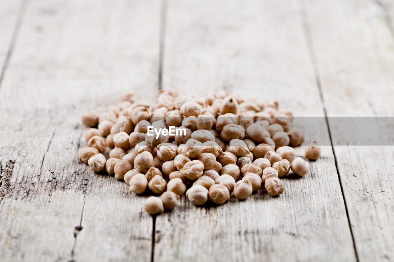 HIGH ANGLE VIEW OF EGGS ON WOODEN TABLE