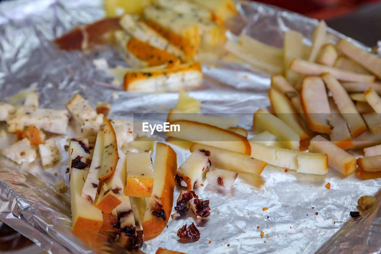 food, food and drink, fast food, freshness, dish, cheese, produce, meal, no people, indoors, healthy eating, close-up, snack, cuisine, wellbeing, still life, cheddar cheese, dairy, high angle view