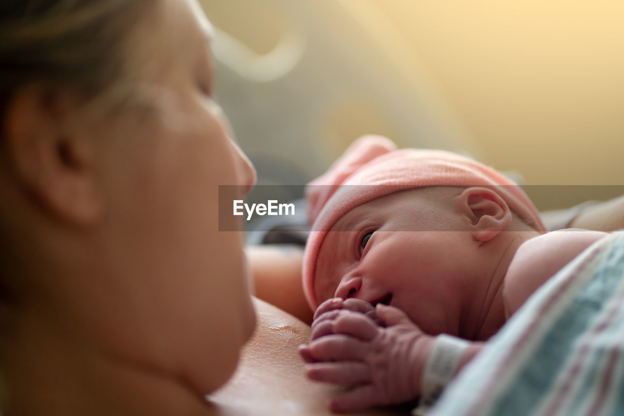 A new baby and mother make eye contact for the first time